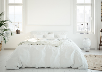 white bedroom with white down comforter